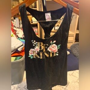 Razor back tank top with floral print says “Be Kind”